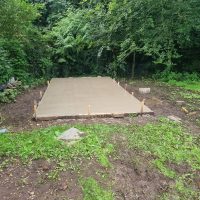 Concrete base for a garden building